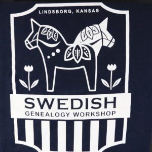 On a shield-shaped border, two stylized Dala horses - with pointed ears and leafy designs - face opposite directions. To their left and right are stylized tulips. Wording reads: "Lindsborg, Kansas. Swedish Genealogy Workshop."